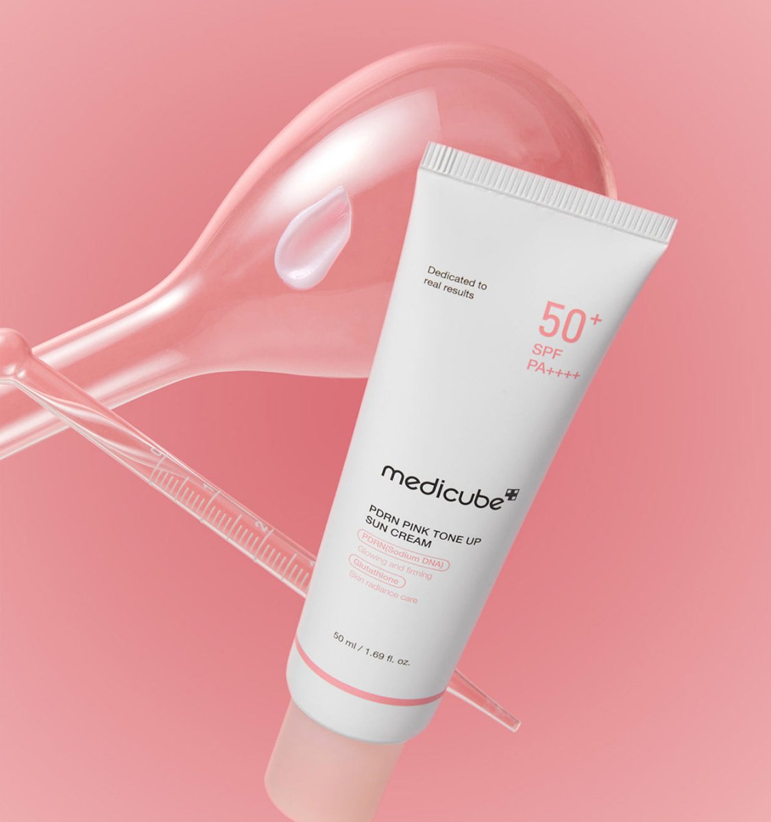 medicube PDRN Pink Tone Up Sun Cream 50ml tube with high SPF displayed against a soft pink background