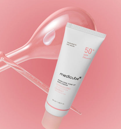 medicube PDRN Pink Tone Up Sun Cream 50ml tube with high SPF displayed against a soft pink background