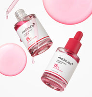 medicube TXA Niacinamide 15% Serum 30ml bottles with pink drops and background illustrating brightening effect