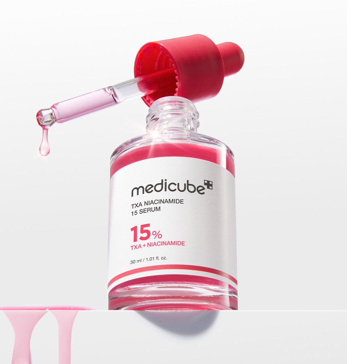 medicube TXA Niacinamide 15% Serum 30ml in clear bottle with red dropper for brightening effect and skin tone improvement