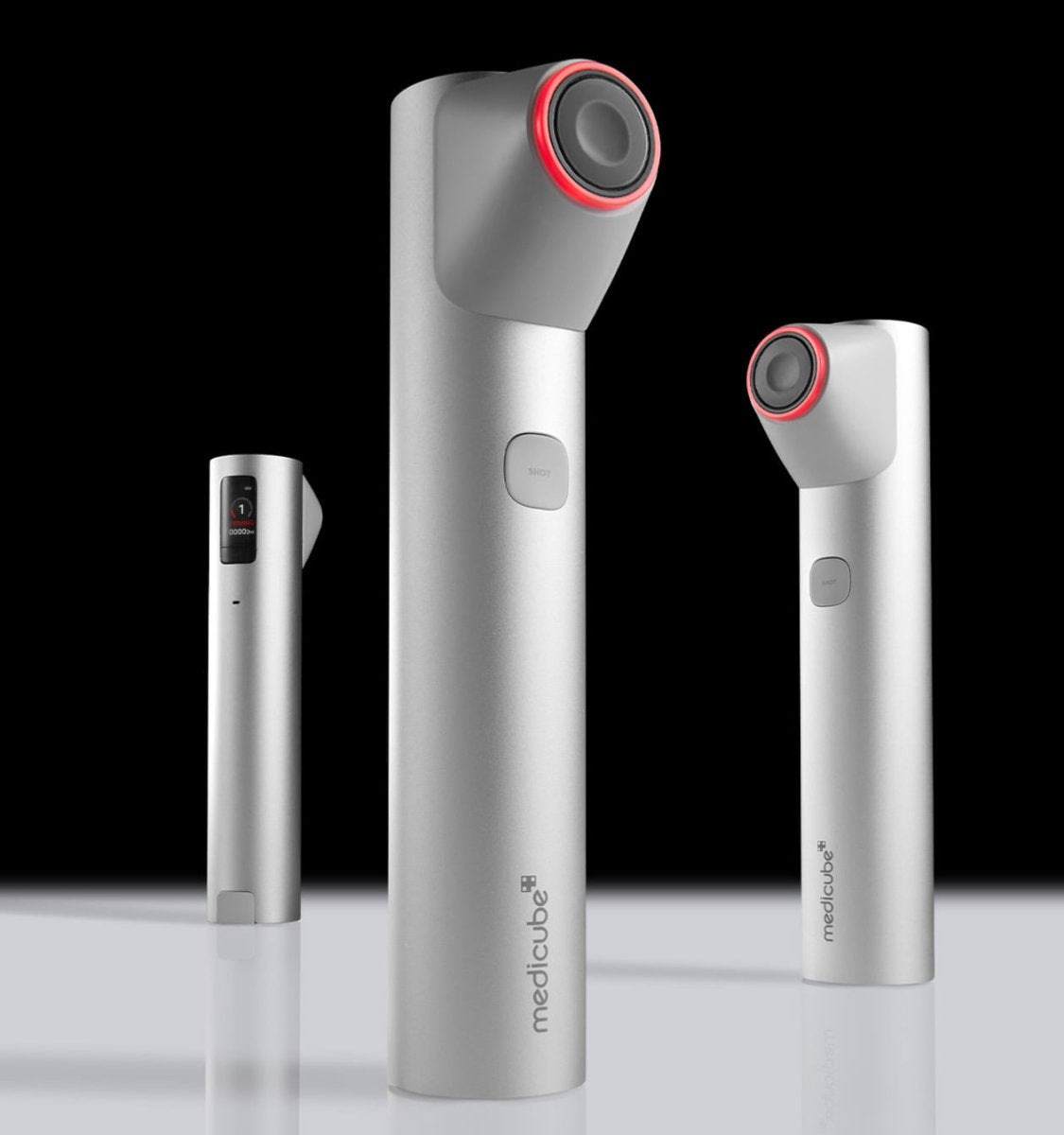 medicube AGE-R HIGH FOCUS SHOT silver device with red ring focusing on elasticity care on black reflective surface