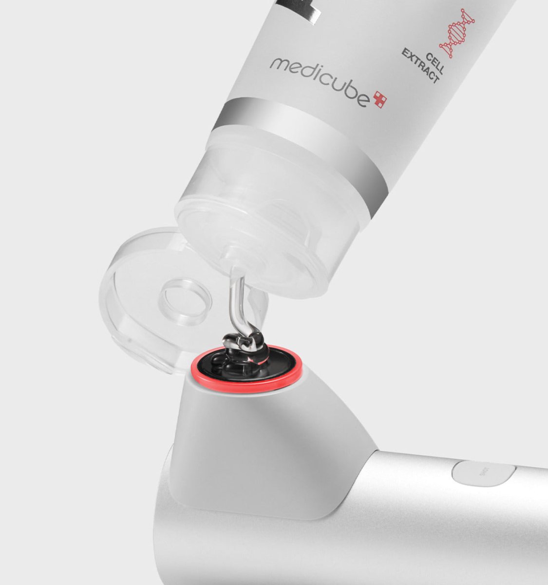 medicube AGE-R HIGH FOCUS SHOT being dispensed into a sleek silver elasticity care applicator device