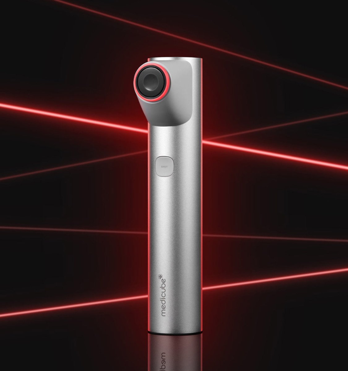 medicube AGE-R HIGH FOCUS SHOT device in metallic finish with red accent for targeted elasticity care and skin treatment
