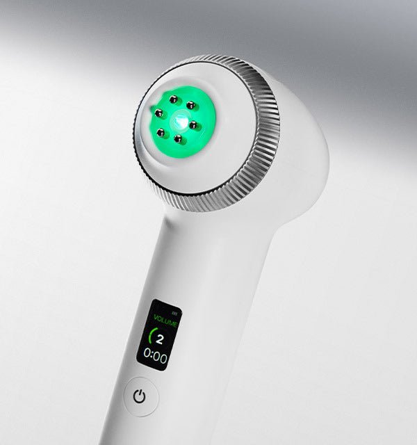 medicube AGE-R Ultra Tune 40.68 device with glowing green treatment head and digital display showing volume level two