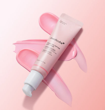 medicube PDRN Pink Peptide Eye Cream 30ml tube with smooth pink cream spread on soft pink background reducing fine lines