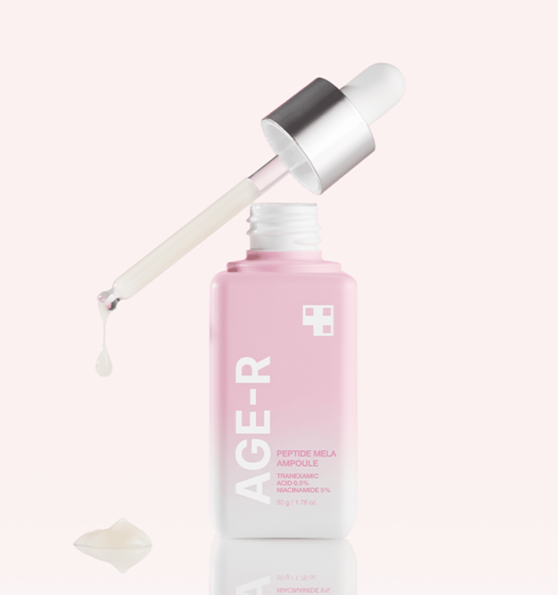 medicube AGE-R Peptide Mela Ampoule 50g in pink bottle with dropper dispensing serum for freckle treatment care
