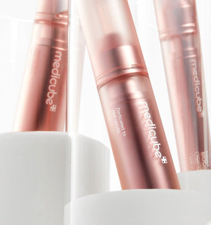 medicube Collagen Glow Booster Serum 15ml in sleek rose gold bottle highlighting deep absorption benefits