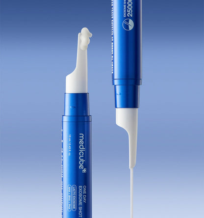 medicube One Day Exosome Shot 25000 13ml blue applicator dispensing serum for intensive pore care on blue background