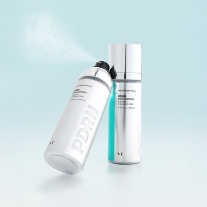 VT PDRN Glow Ampoule 100ml in sleek silver bottles showcasing revitalizing boost with fine mist spray against light blue background