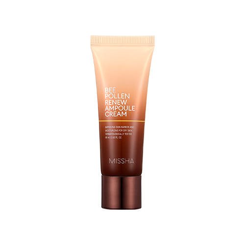 Gradient peach to brown tube of nourishing ampoule cream with brown cap on a white background