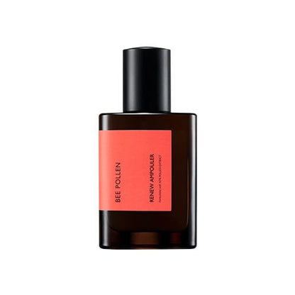 Amber glass bottle with black cap and coral label featuring skin energy ampoule on white background