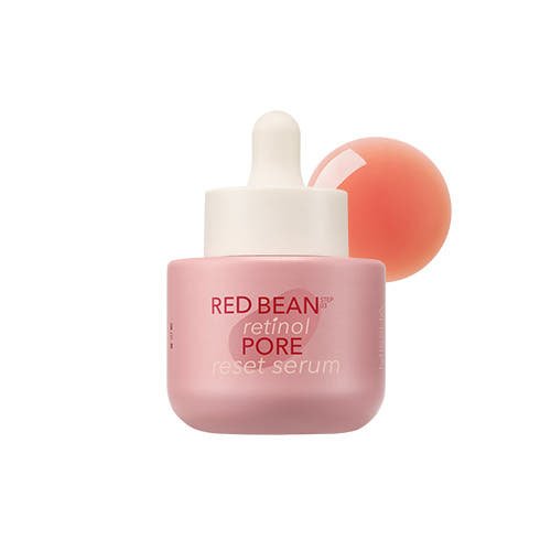 Pink frosted glass dropper bottle of retinol serum with red bean extract for pore minimization on white background