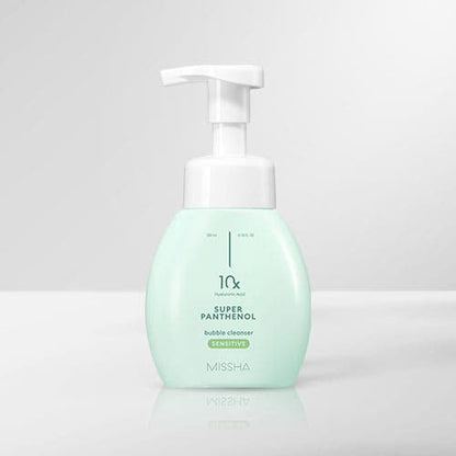 Light green foam cleanser bottle with white pump for gentle deep cleansing on plain light gray background