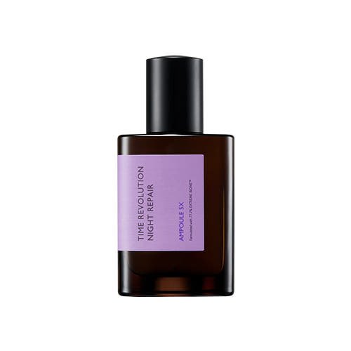 Dark amber glass bottle with black cap and light purple label for night repair ampoule skincare product