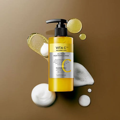 Yellow pump bottle of vitamin C foam cleanser with ascorbic acid and foam texture on a brown surface background