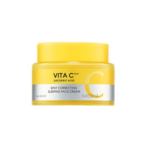 Yellow jar of brightening spot correcting sleeping mask cream with ascorbic acid on a white background