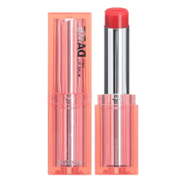 Sheer red lip balm with moisturizing formula housed in a transparent coral pink tube with silver inner casing