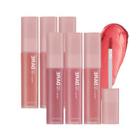 Set of six muted pink and red velvet lip tints with smooth application and one open showing applicator and swatch