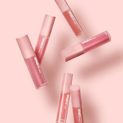 Set of six smooth-application lip tint tubes in muted pinks arranged on pale pink background