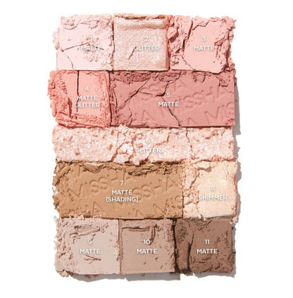 Pressed rosy and neutral matte, shimmer, and glitter eyeshadows in a versatile palette with soft, blended texture details