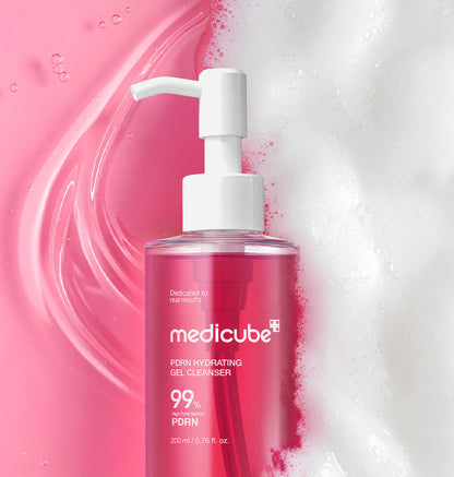 medicube hydrating gel cleanser in pink bottle with pump on pink gel and white foam background moisturizing formula