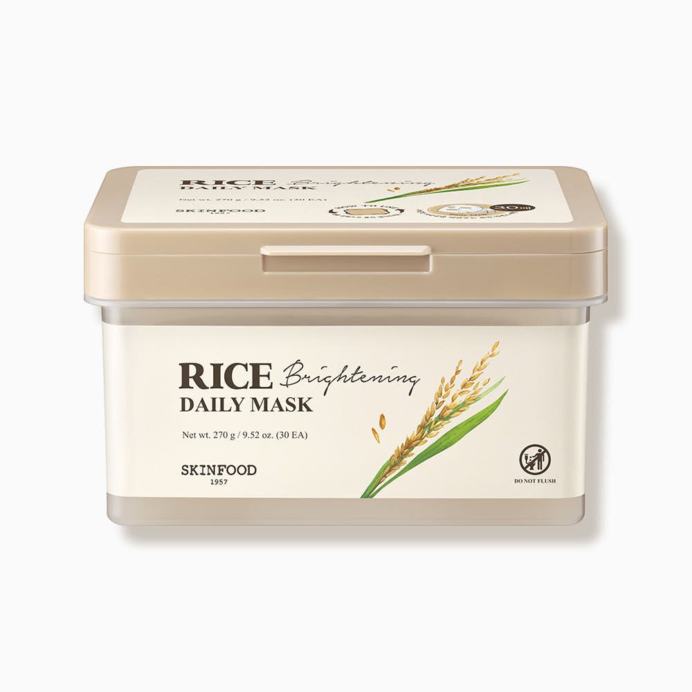 Square beige container of brightening rice daily mask with rice grain illustration on cream label