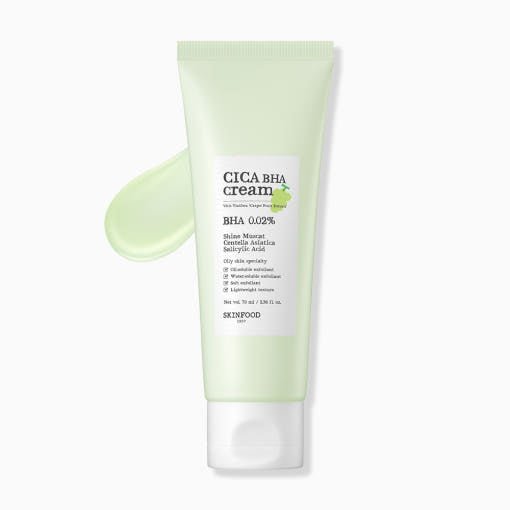 Pale green tube of soothing cica cream with smooth texture swatch on white background