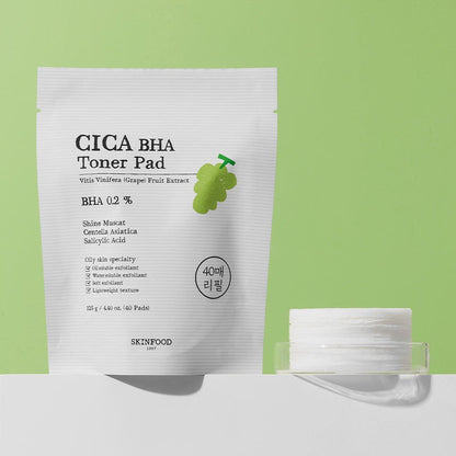 White resealable pouch with grape illustration and stack of toner pads on pale green background