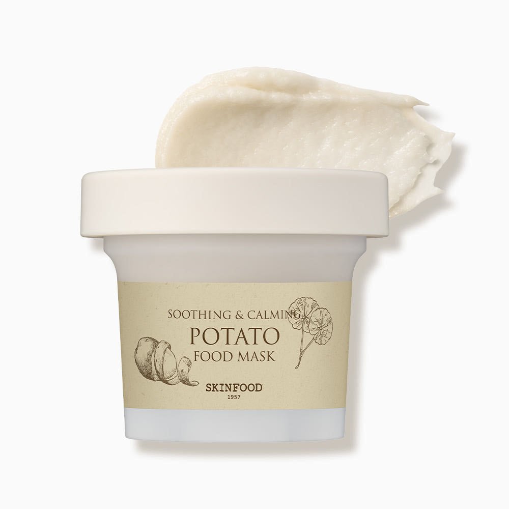 Small beige jar of soothing potato food mask with creamy texture swatched above on white background