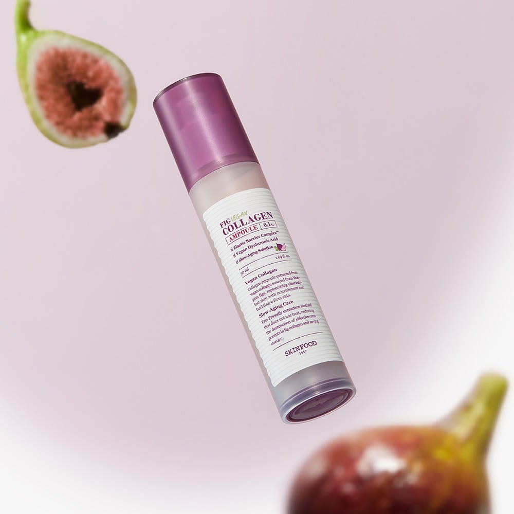 White ampoule bottle with purple cap labeled for vegan collagen, surrounded by fresh fig halves on pale pink background