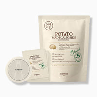 Beige refill pouch with potato soothing pads alongside individual pad packets and a round pad container for calming skin care.