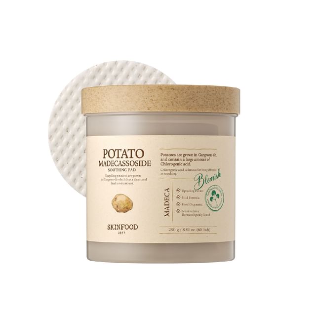 Container of soothing potato extract facial pads with textured cotton pad against white background