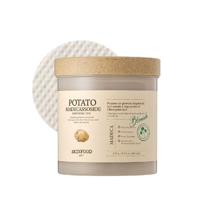 Container of soothing potato extract facial pads with textured cotton pad against white background