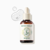 Amber dropper bottle of hydrating water parsley ampoule with clear serum drops on white background