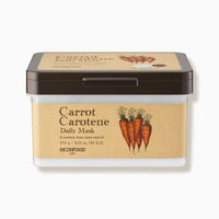 Rectangular container of carrot-infused daily mask sheets with brown lid and natural beige label displaying carrot illustration
