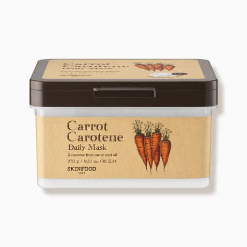 Rectangular container of carrot-infused daily mask sheets with brown lid and natural beige label displaying carrot illustration