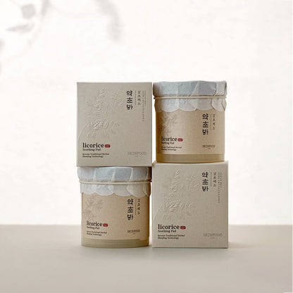 Stacked beige jars and boxes of licorice soothing pads featuring subtle herbal embossing and natural calming design