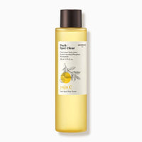 Yellow toner bottle with black cap and label featuring yuja fruit illustration and brightening benefits text