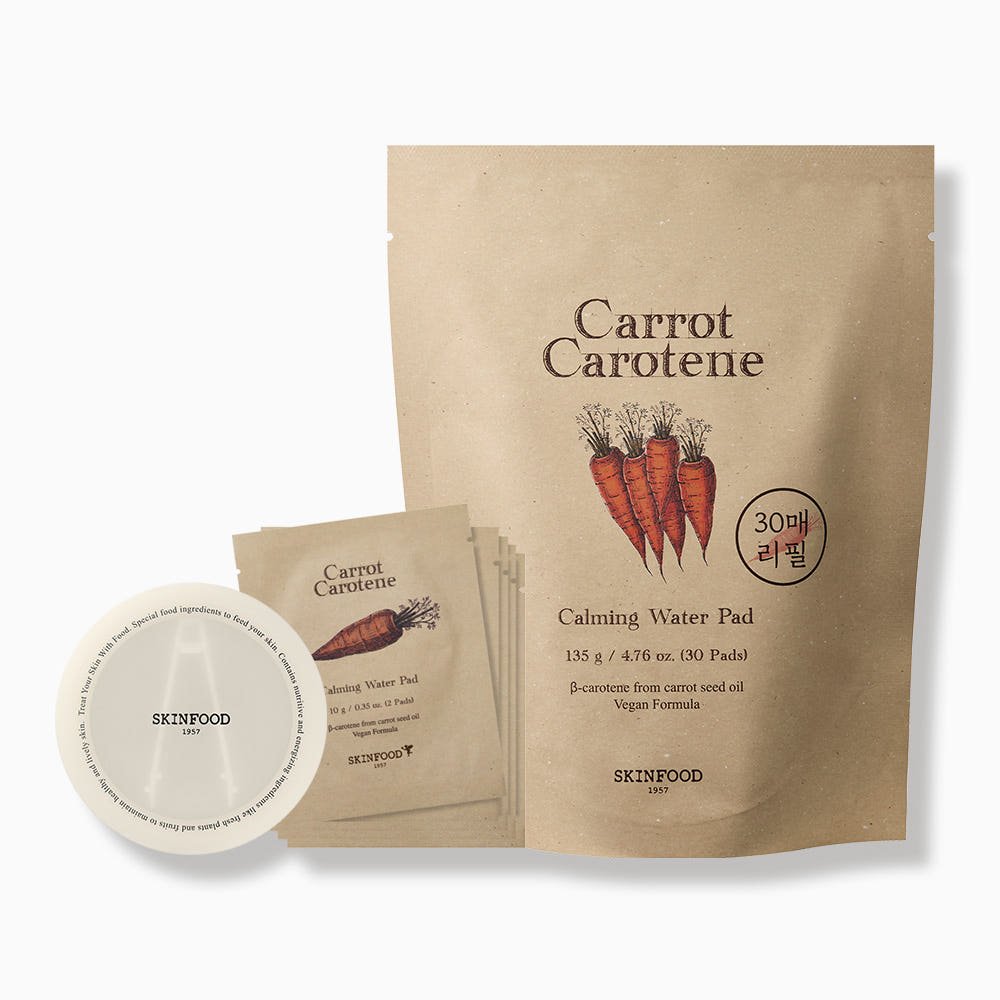 Natural beige refill pack of calming water pads with carrot illustration and white circular pad container beside several individual packets