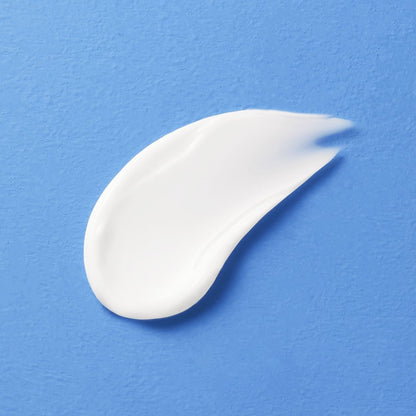 Smooth white moisturizer swatch on a blue background highlighting creamy texture and hydration boost benefits