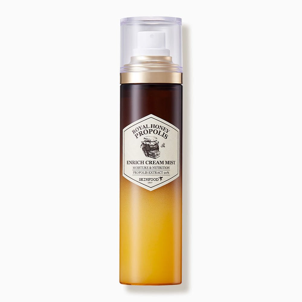 Slim mist bottle with gradient amber design and label highlighting moisturizing royal honey propolis formula