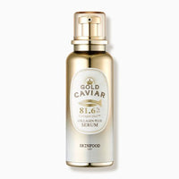 Gold-toned serum bottle with white label featuring gold caviar and collagen plus design for nourishing skincare.