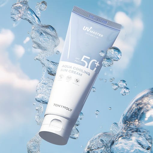 Light blue and white tube of cooling sun cream with SPF50+ surrounded by splashing water droplets on blue sky background