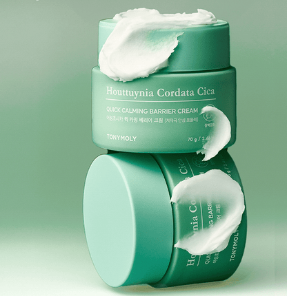 Mint green jars of calming barrier cream with creamy white texture swirled on top and side against pale green background