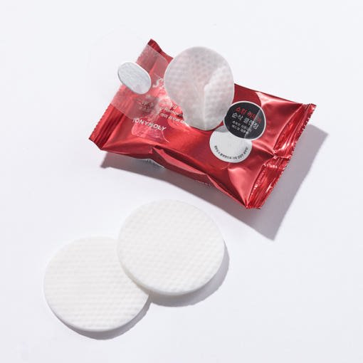 Red metallic pack of gentle remover pads with textured white cotton pads on white background