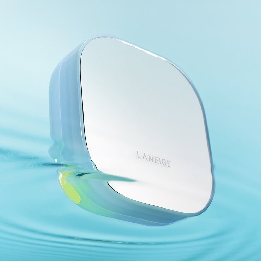 LANEIGE Neo Cushion Mewy SPF42 PA++ 15g compact case in sleek design floating above soft blue water surface
