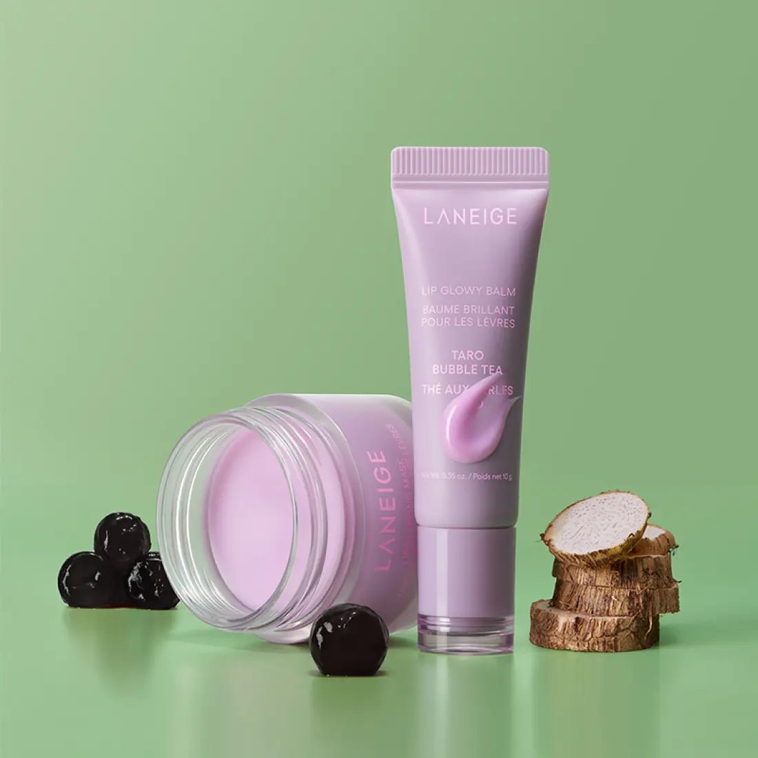 LANEIGE LIP GLOWY BALM 10ml #Taro Bubble Tea in soft purple tube with balm swatch next to taro root slices and tapioca pearls
