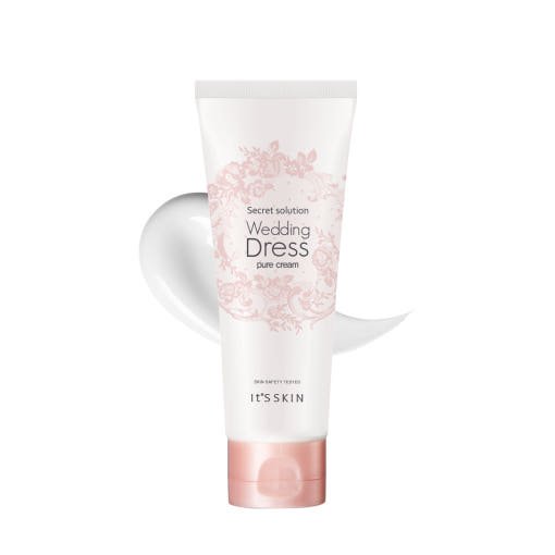 White tube of tone-up cream with delicate pink floral design and soft cream swatch behind on white background
