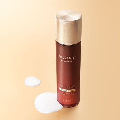 Brown and gold bottle of nourishing glow emulsion with white lotion drops on a soft beige background