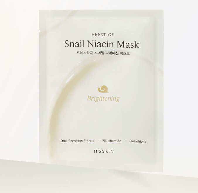 Minimalist white pouch of brightening snail niacin face mask with key ingredients and subtle gold snail icon